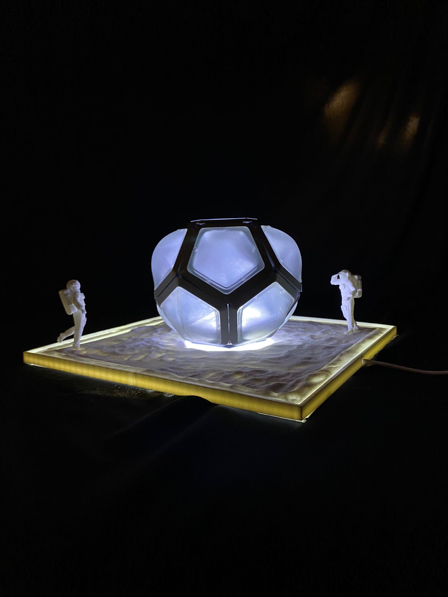 Illuminated scale model on lunar diorama